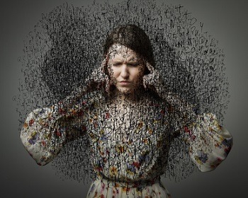 A woman in a patterned dress holds her head with both hands, surrounded by a chaotic cloud of jumbled black letters and symbols, highlighting the difference between clarity and confusion—a stark visual metaphor that overwhelms like an SEO algorithm gone awry.