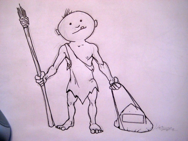 A cartoon drawing of a cave person with a round face, holding a long spear and an inventive vacuum cleaner. Adapting to a changing world, their small, muscular body dons tattered cloth while showcasing the vacuum cleaner crafted from simple objects.