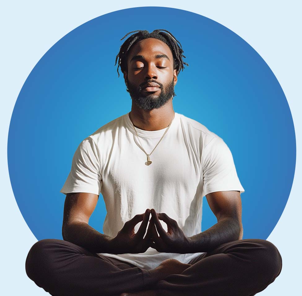 A man with closed eyes is seated cross-legged, meditating against a blue circular background. As a beginner on his neurosculpting learning path, he wears a white T-shirt and dark pants, with a pendant necklace. His hands rest on his knees, forming a mudra with index fingers and thumbs touching.