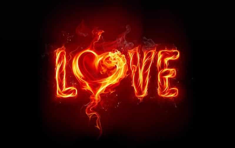 The word "LOVE" blazes against the black background, with the "O" shaped like a heart. Red and orange flames evoke a feeling of being loved, creating a vibrant, glowing effect that feels like it’s everyone's birthright.
